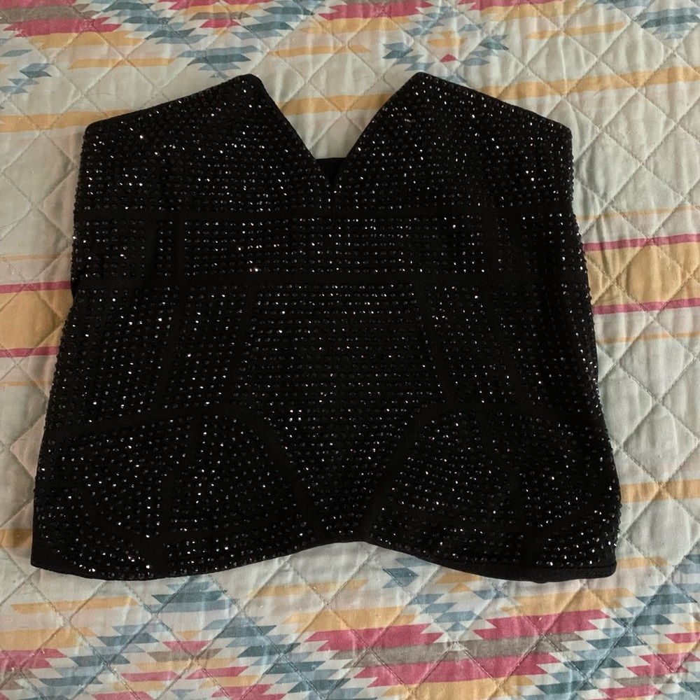 Never worn, small, strapless spark top.